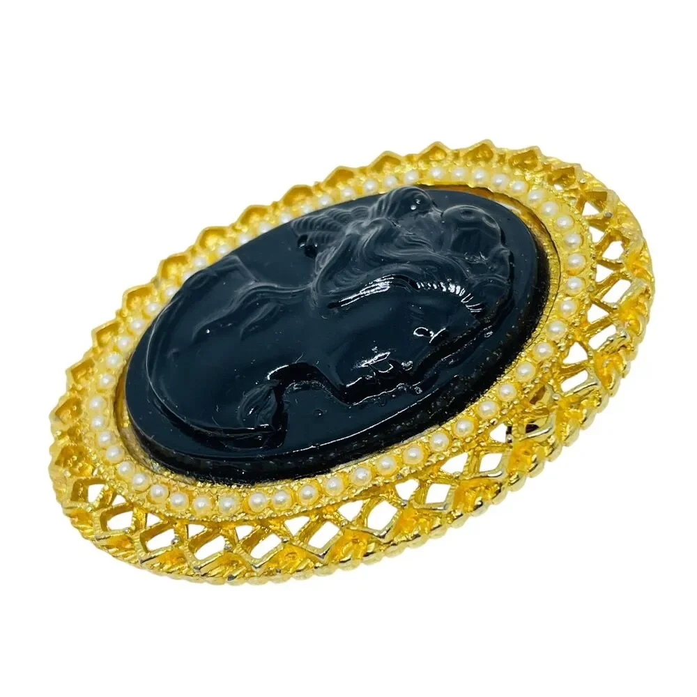 Vintage gold tone molded glass black cameo brooch
